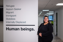 IRC Employee beside IRC values-beliefs